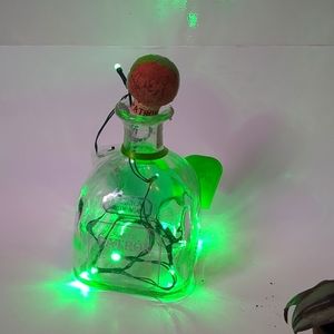 A patron tequila bottle lights.